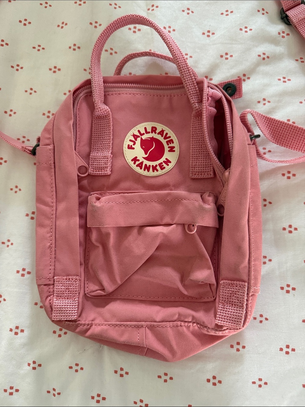 Fjallraven pink crossbody bag.